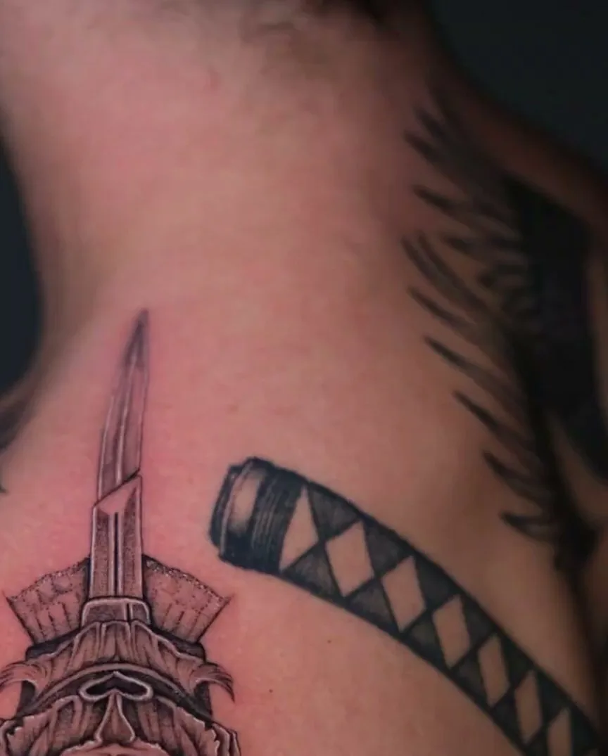 blackwork tattoo, ornate dagger on the shoulder