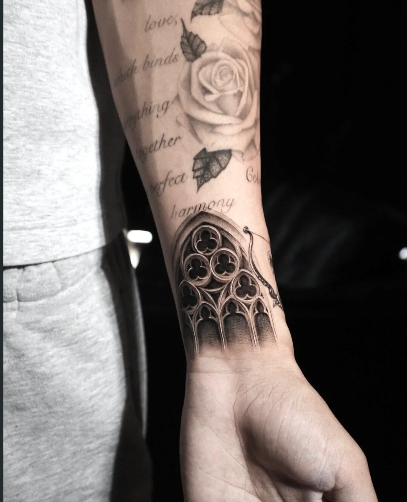 fine line tattoo, rose and script sleeve on the forearm