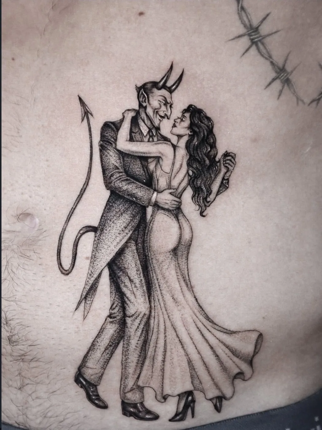 fine line tattoo, dancing with the devil on the chest