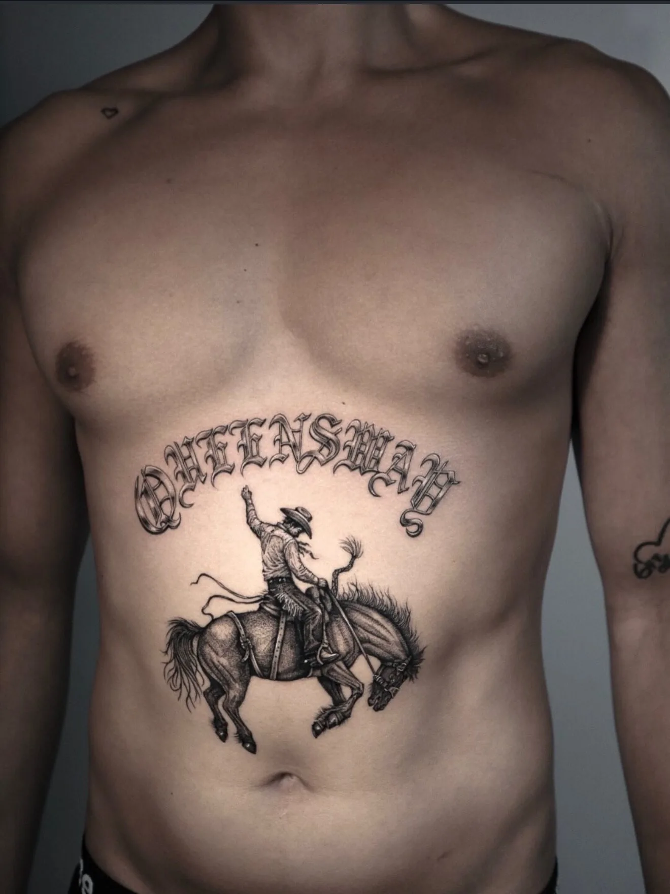 traditional tattoo, bronco rider on the stomach