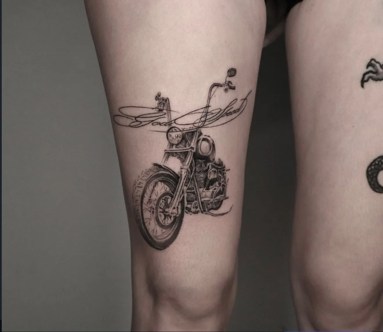 custom design tattoo, motorcycle on the thigh