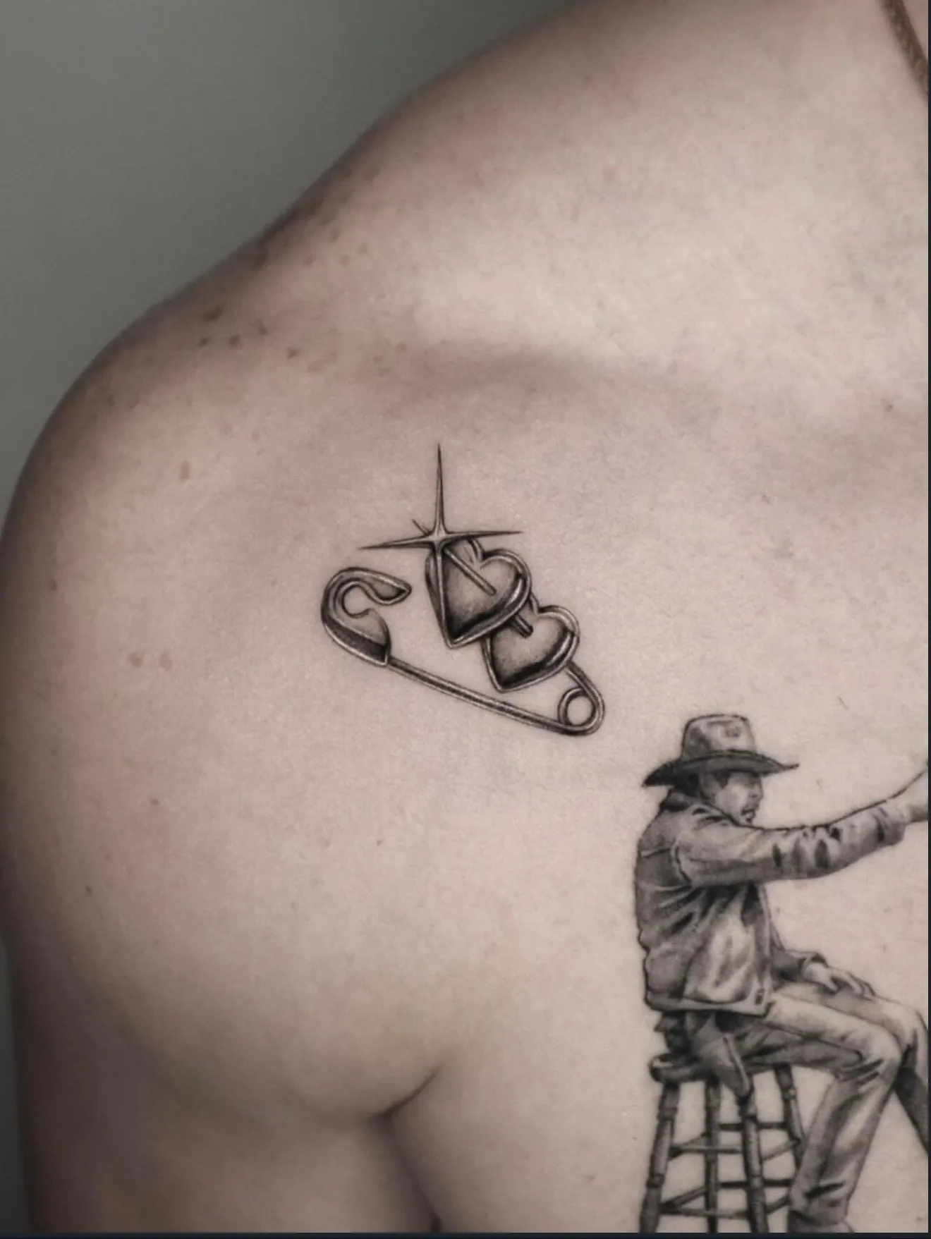realism tattoo, heart and figure on the chest